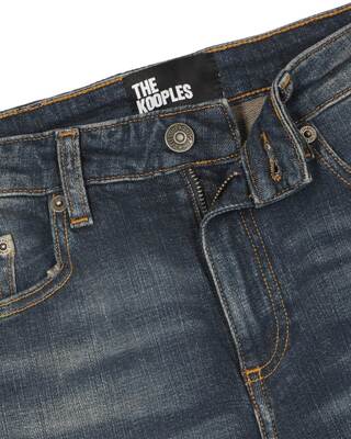 Jean bootcut avec abrasions bleu