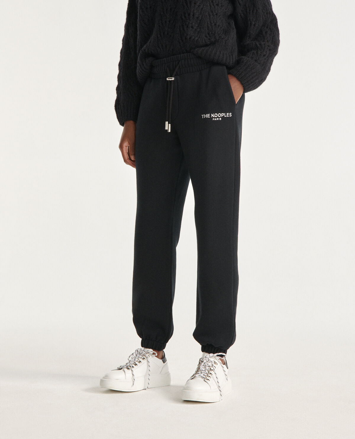 Black joggers with silver relief logo