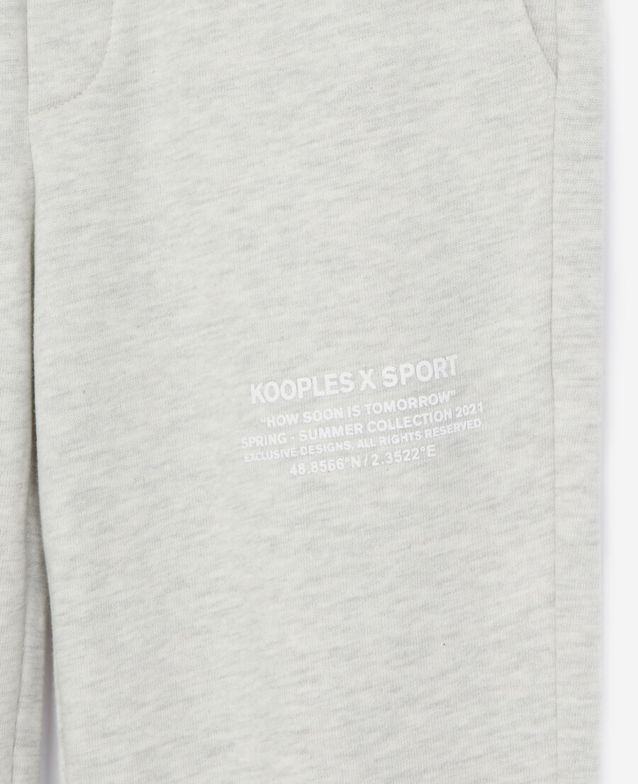 gray joggers with rubber logo