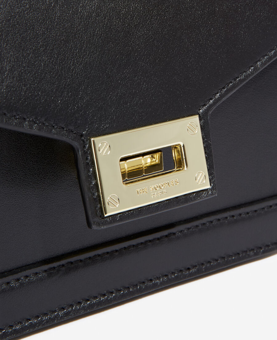 small black leather handbag with gold details
