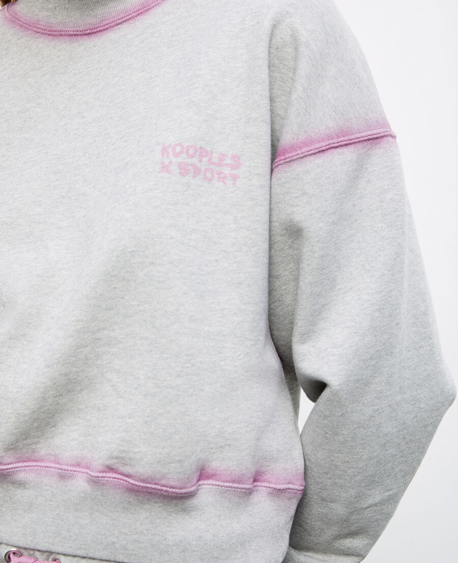 grey sweatshirt with pink details and fading