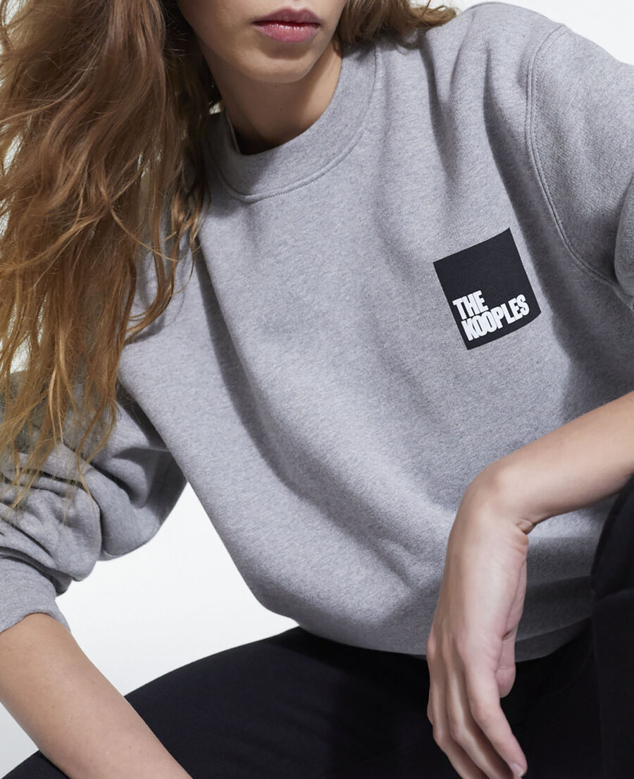 gray sweatshirt with logo
