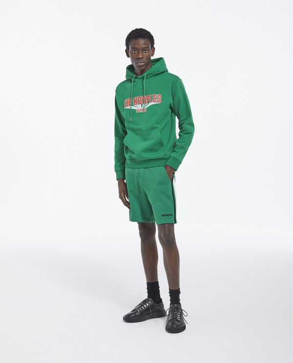printed green hoodie with contrasting logo