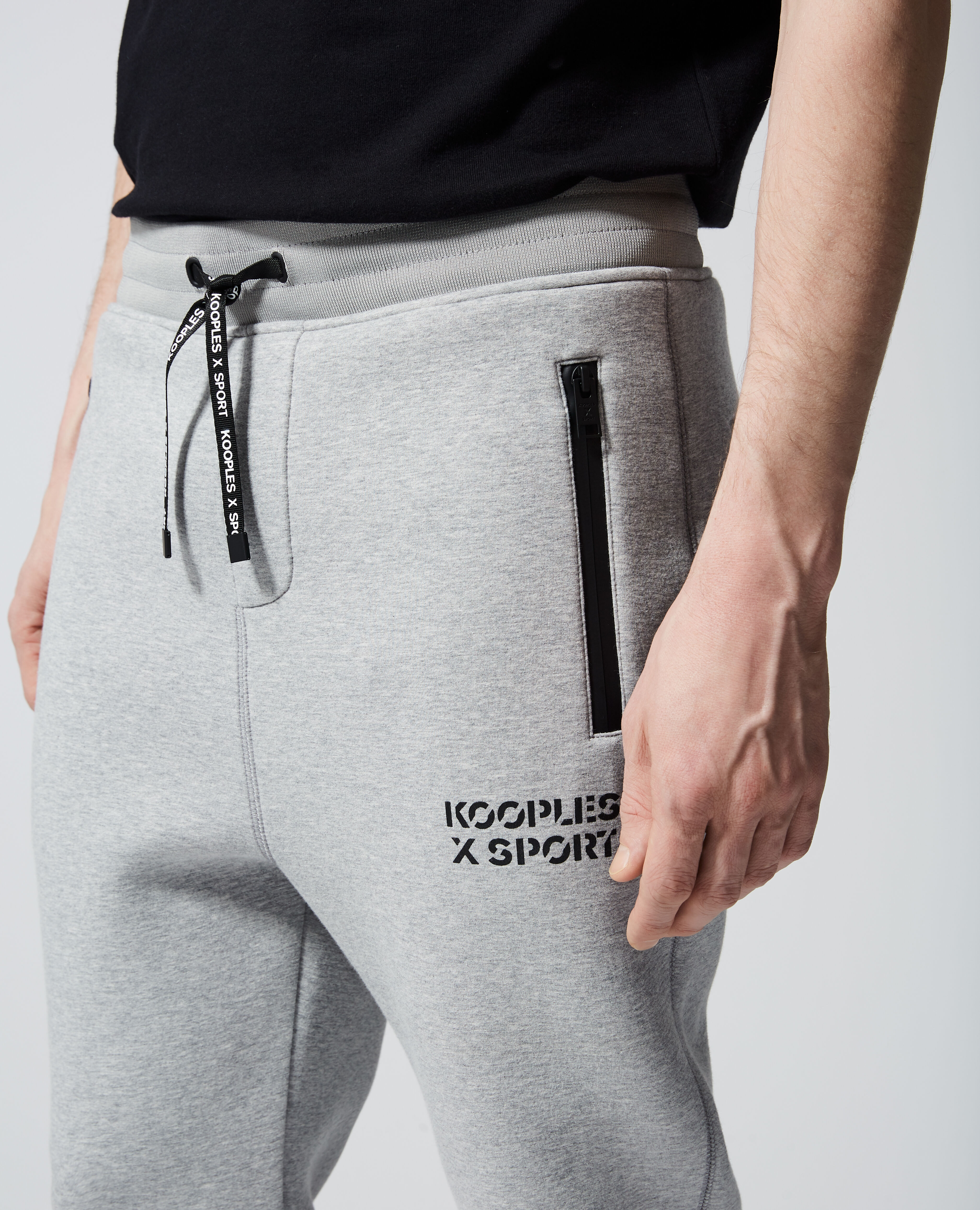 Jogging gris clair stretch zippe a logo