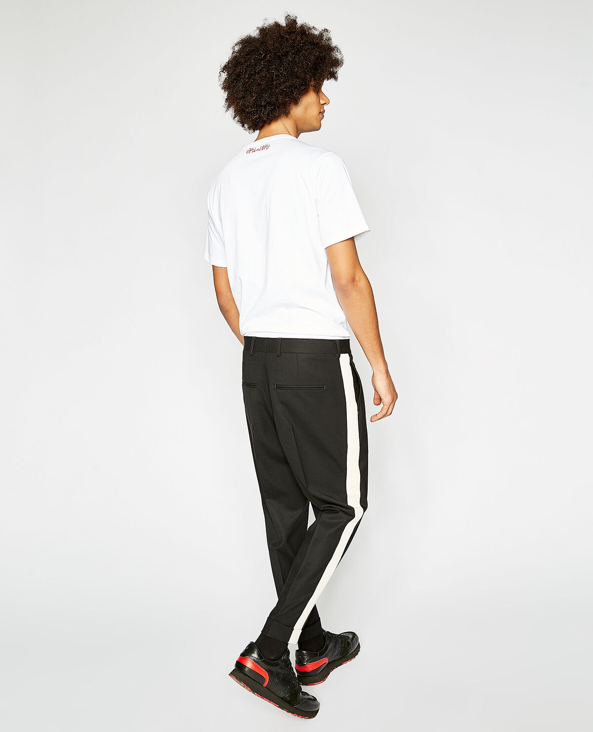 Pantalon noir galon blanc
