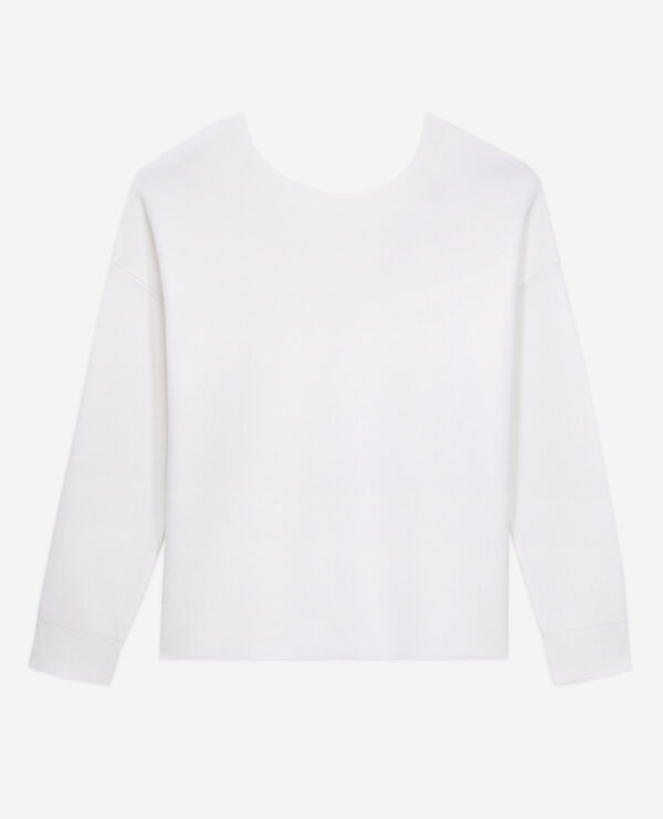 ecru sweater with buttoning on the back
