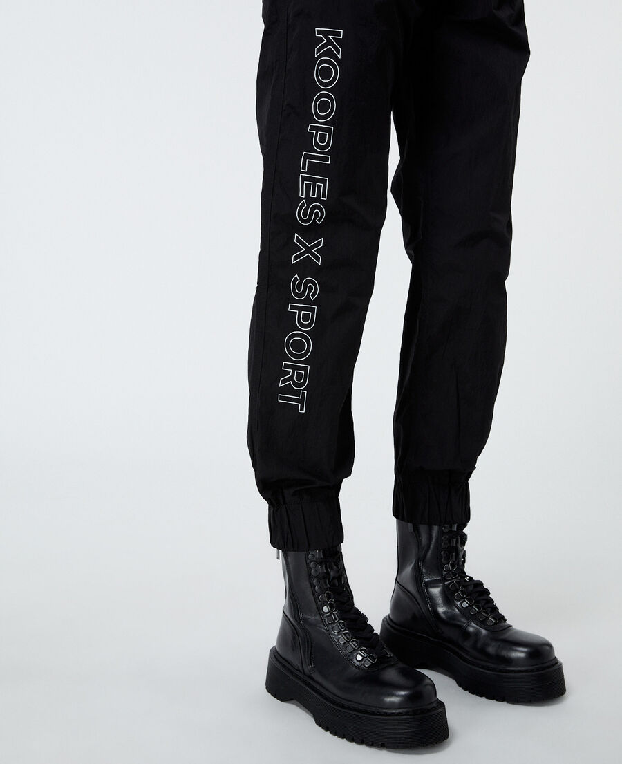 pantalón negro bandas logotipo laterales