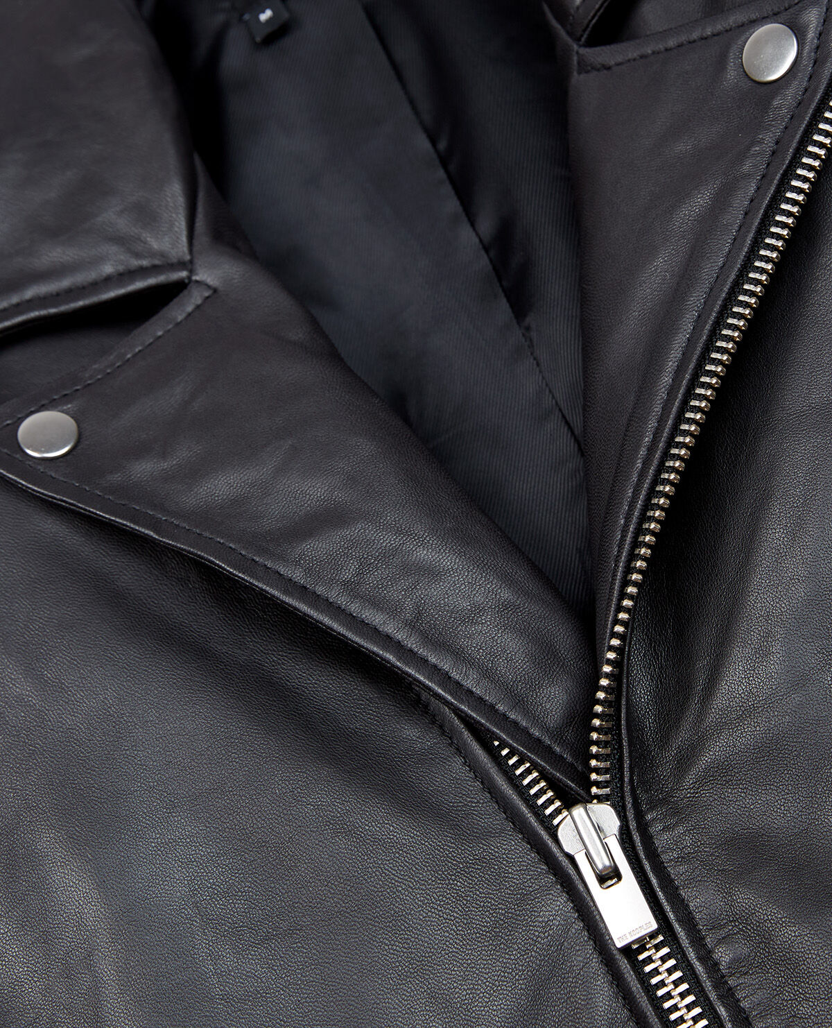 Zipped black leather biker jacket