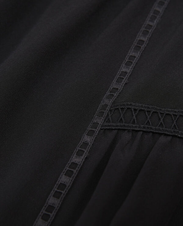 jupe soie noire courte à détail gallon