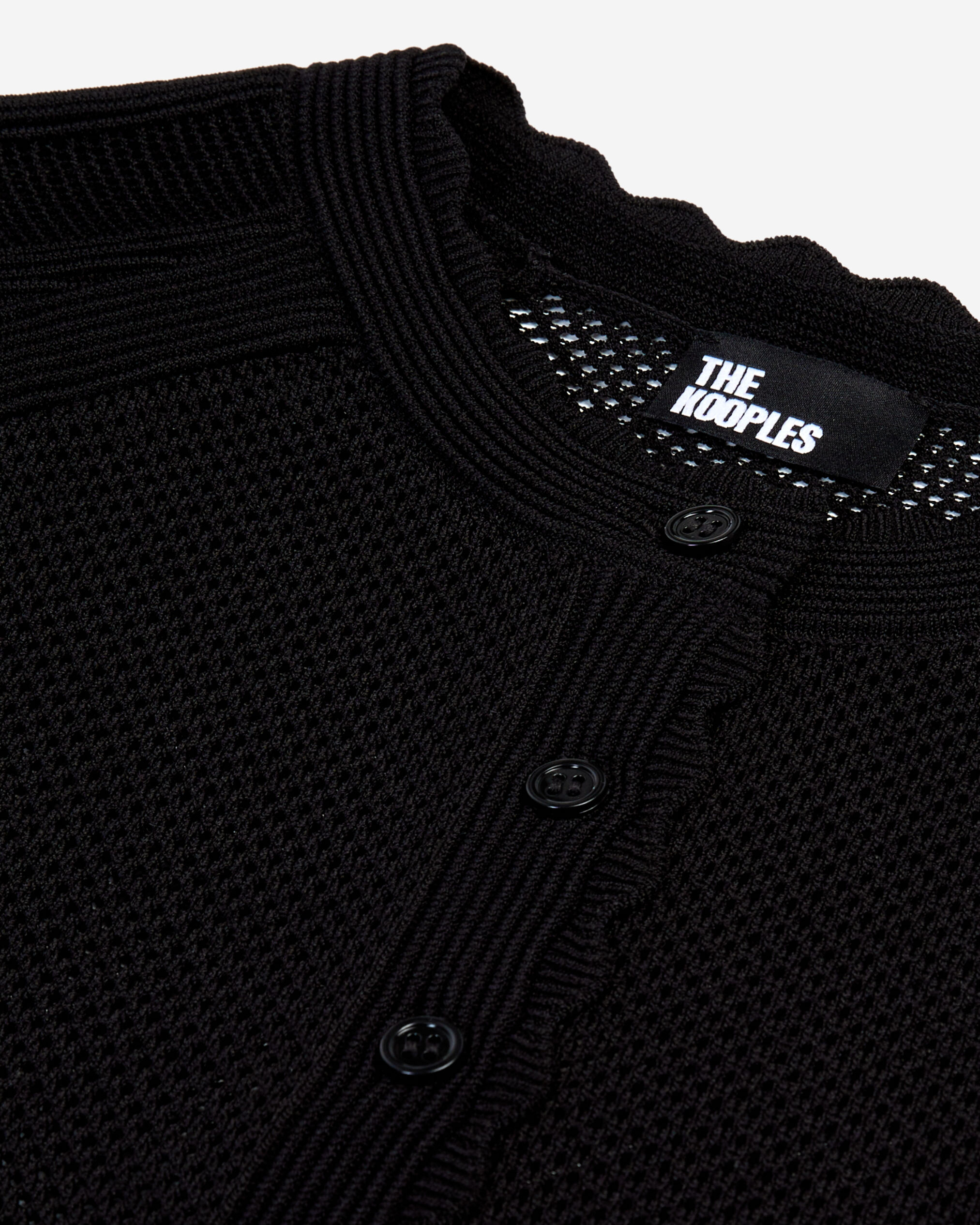 Short black openwork knit cardigan