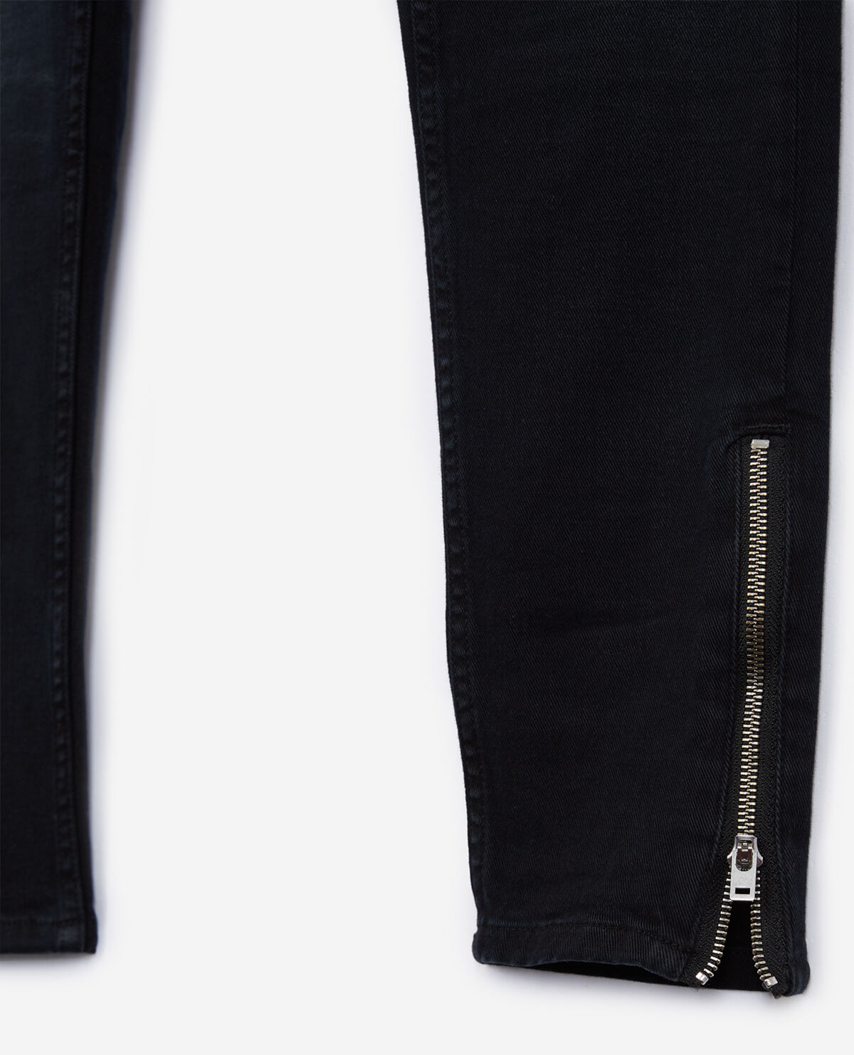 Black skinny jeans with zips at the bottom of the legs