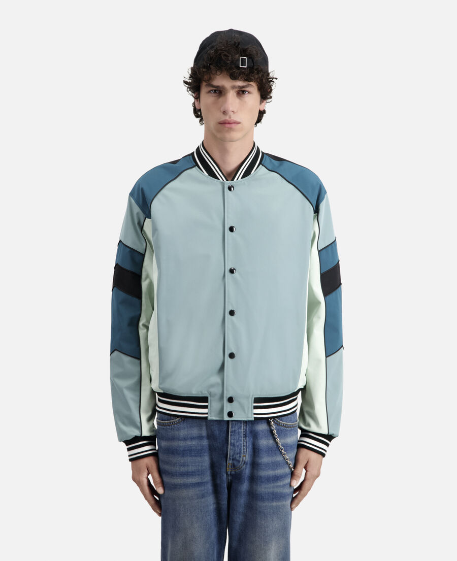 blue and green jacket with patchwork