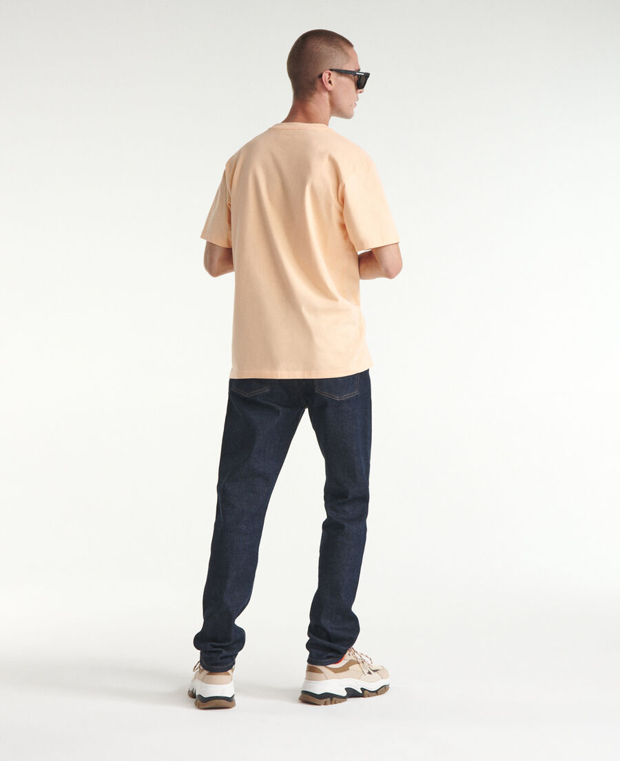 coral-orange cotton t-shirt with 'k' monogram