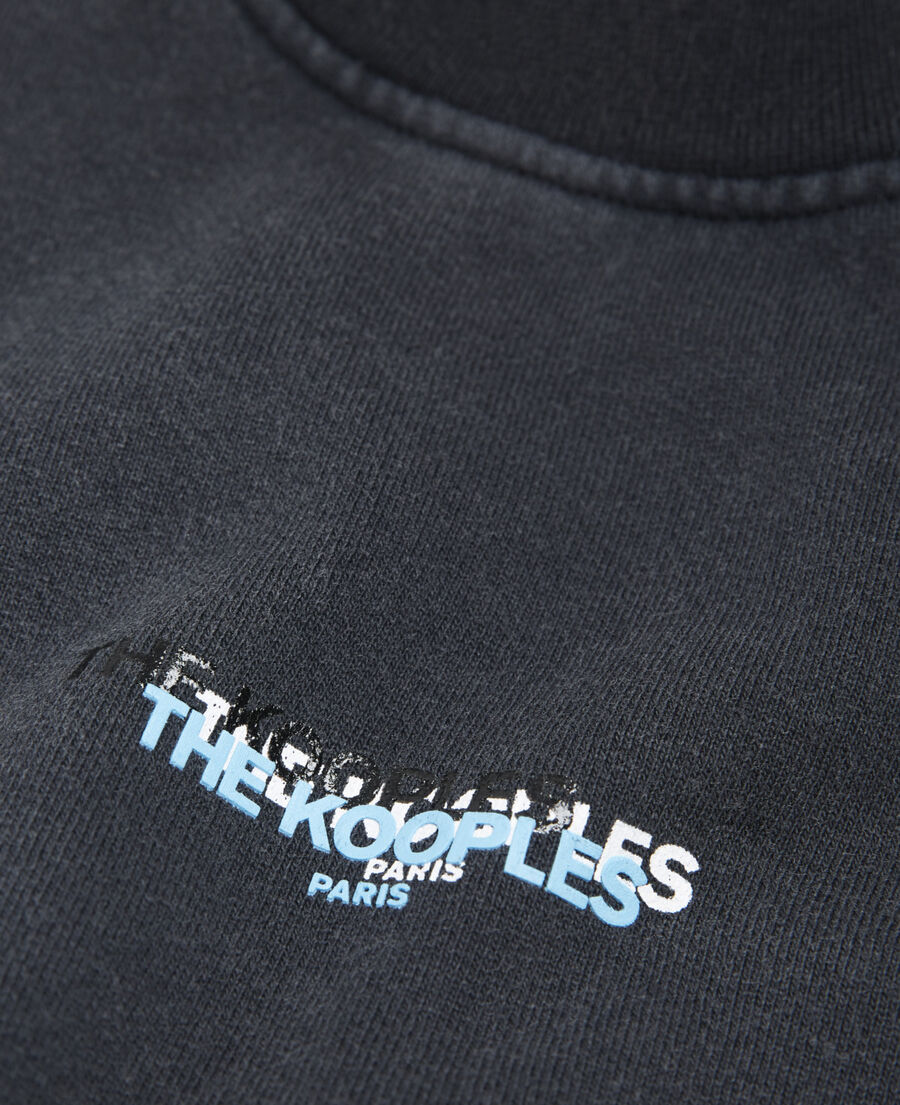 faded black sweatshirt with triple logo