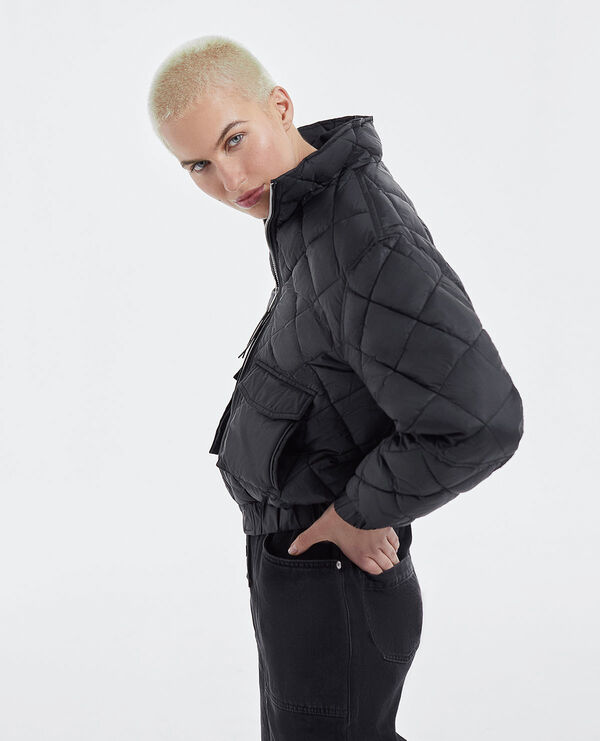 zipped black quilted technical jacket
