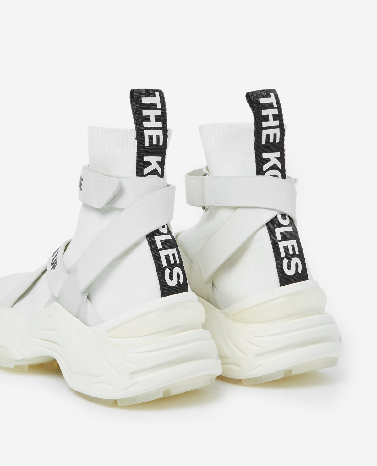 Slick white high top trainers with text