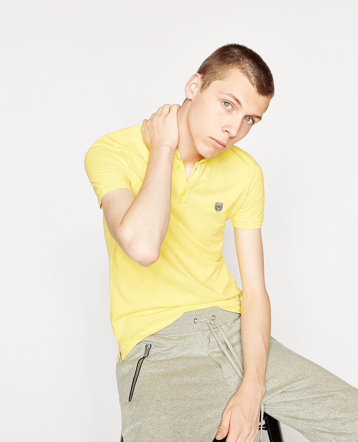 Bright yellow cotton polo shirt with officer collar and purple details