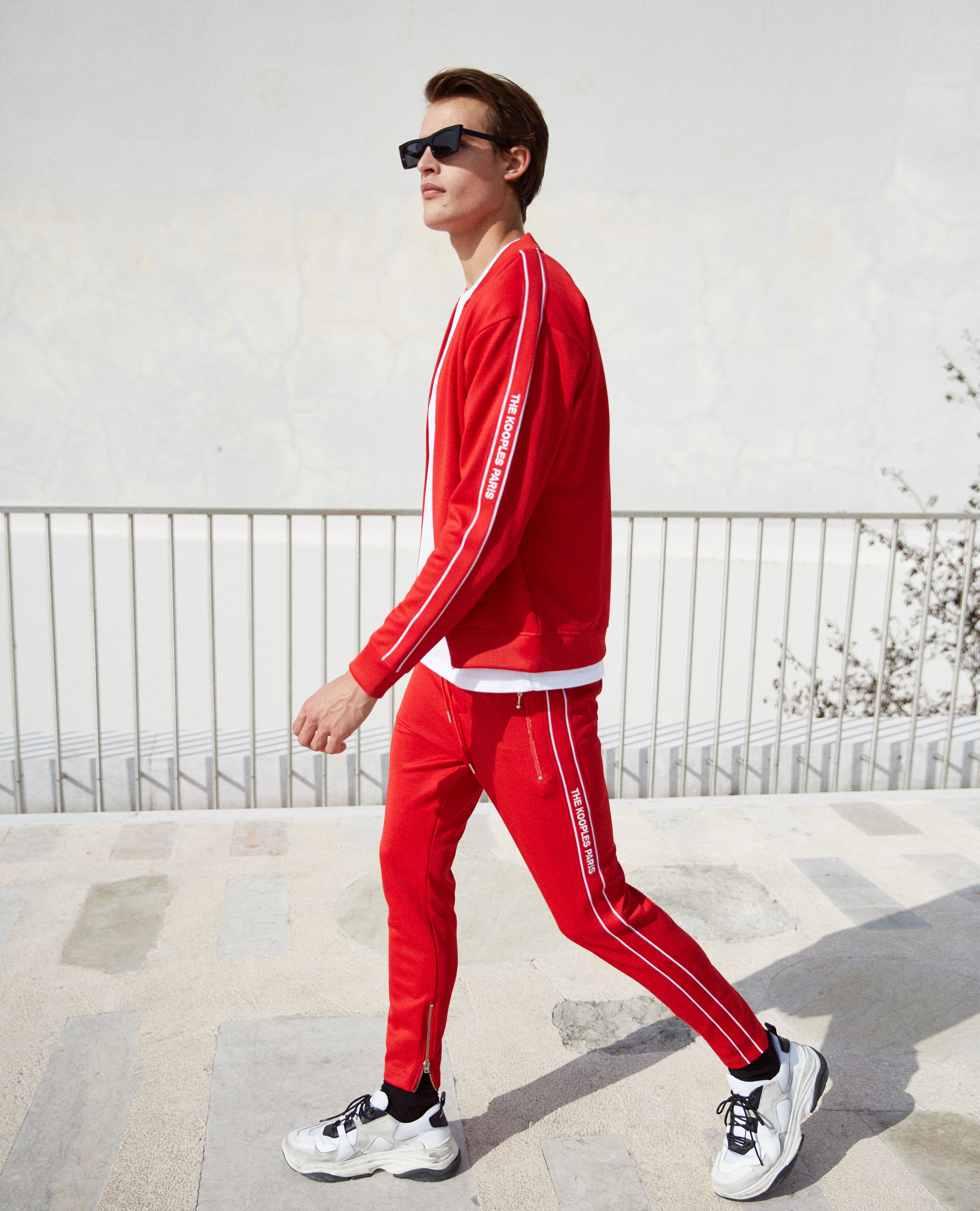 Skinny red joggers with red band logo and zip The Kooples