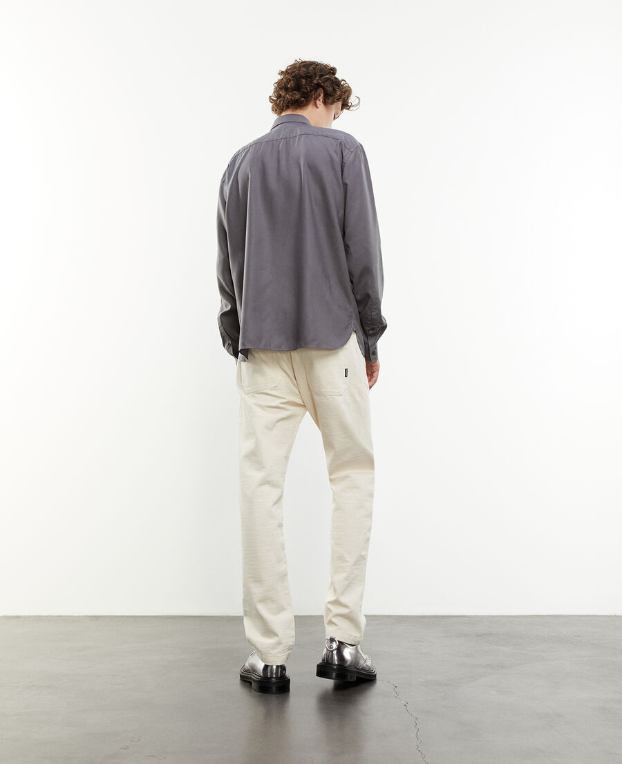 gray flowing shirt with long sleeves