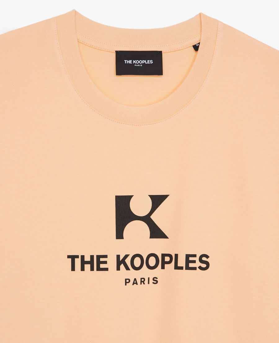 coral-orange cotton t-shirt with 'k' monogram