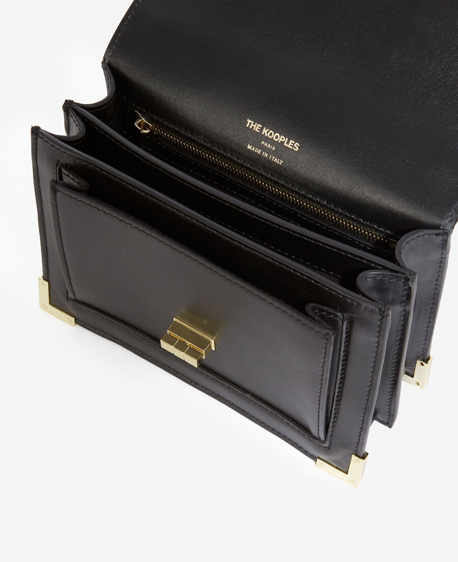 small black leather handbag with gold details