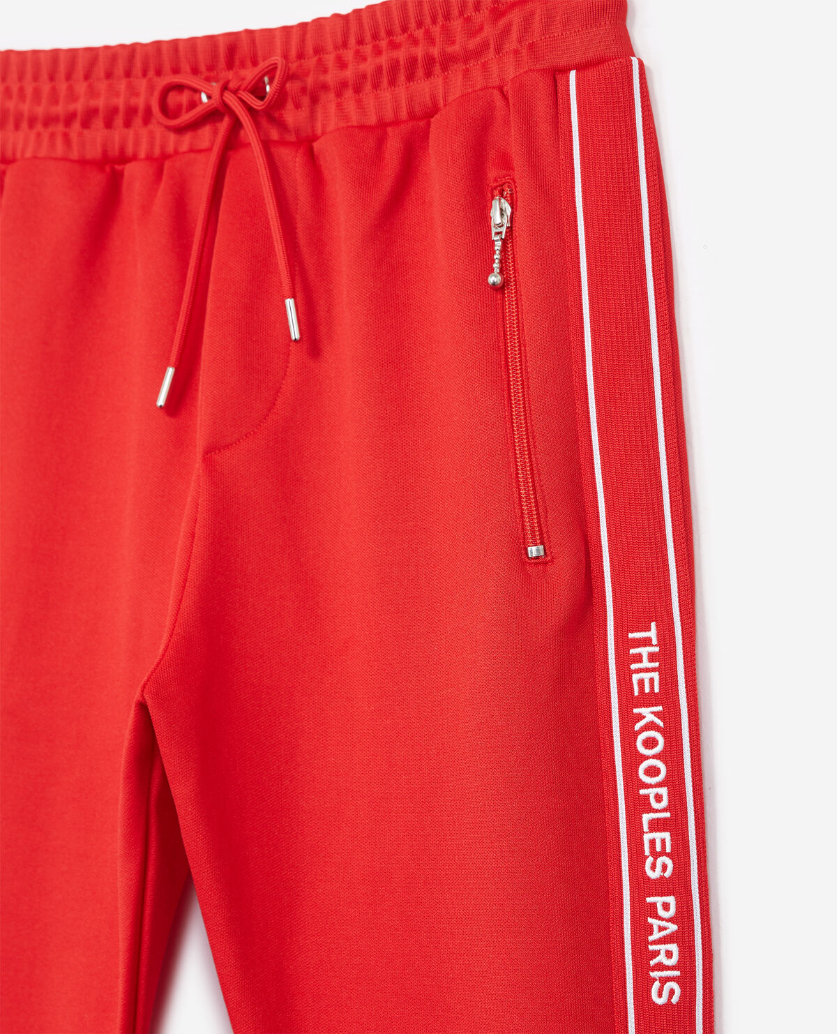 Skinny red joggers with red band logo and zip The Kooples