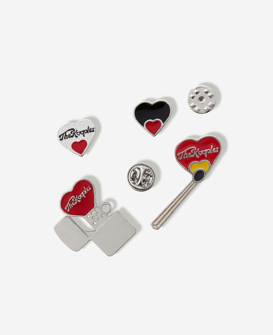 black and white silver pins with red heart