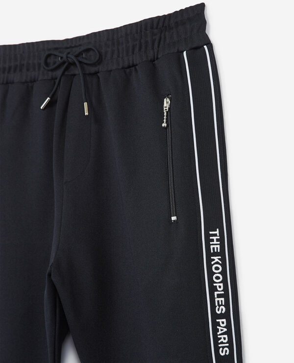 The Kooples HOMME NAVY bas de jogging skinny bleu marine avec bande rouge et logo et zip