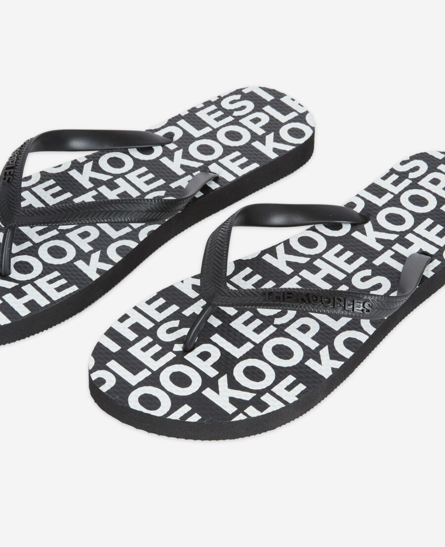 black rubber flip-flops with all-over print