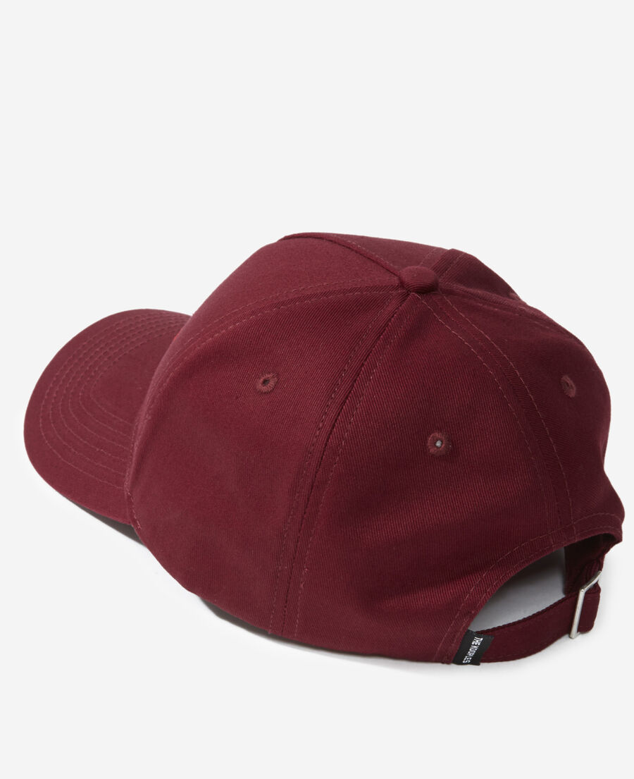 burgundy cotton cap with embroidered “what is”