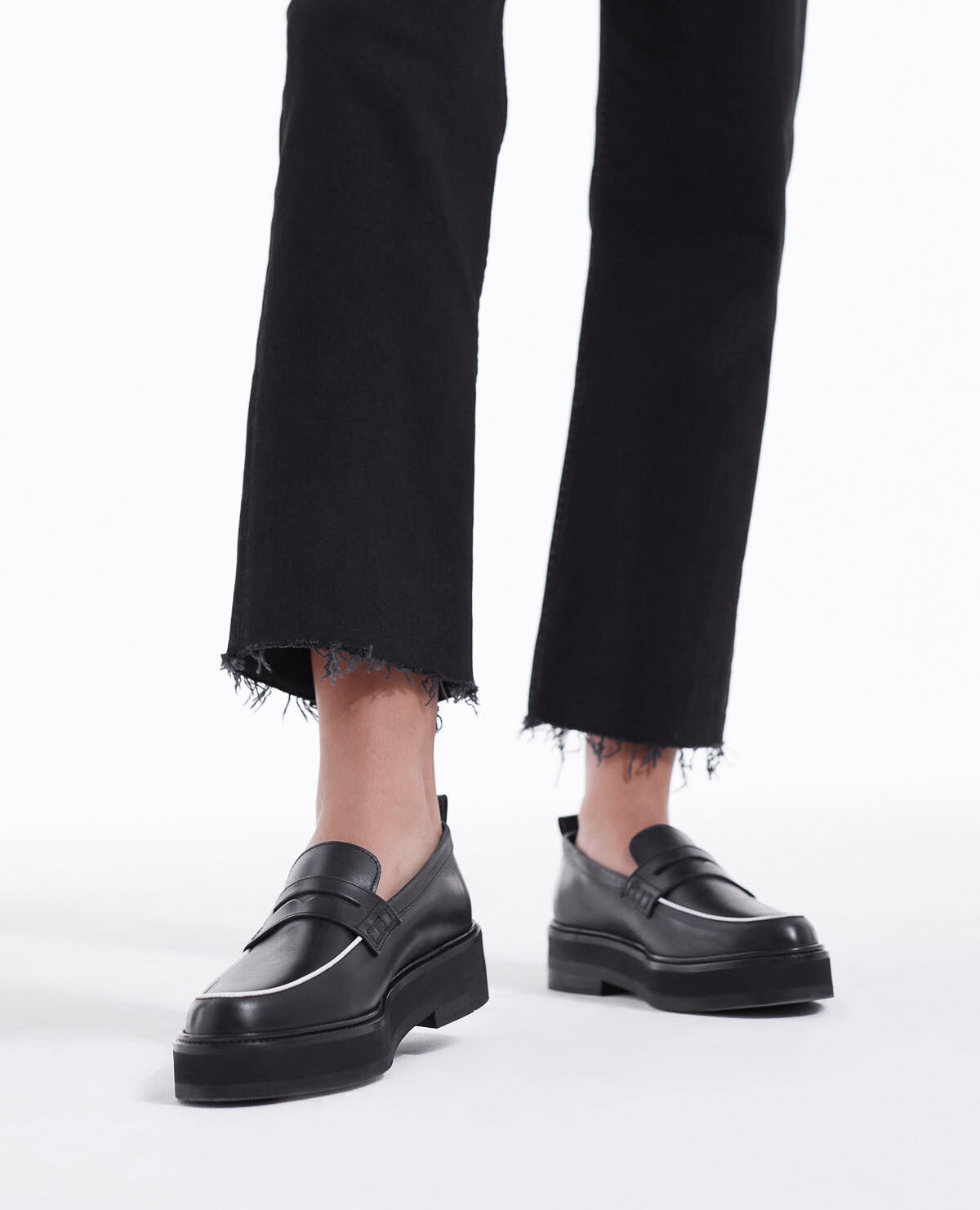 Black leather moccasins with contrast trims