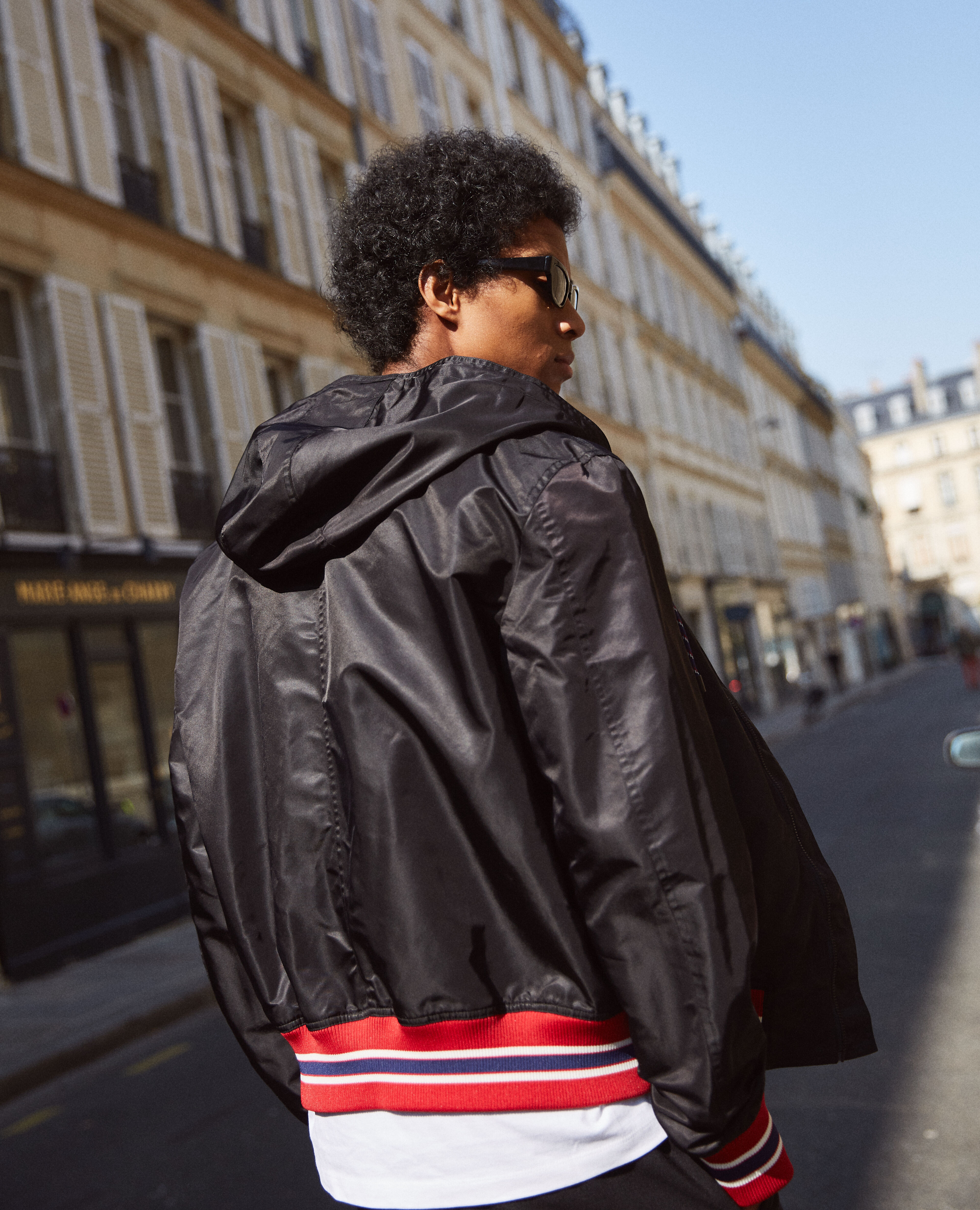 Black hooded jacket with tricolour ribbing