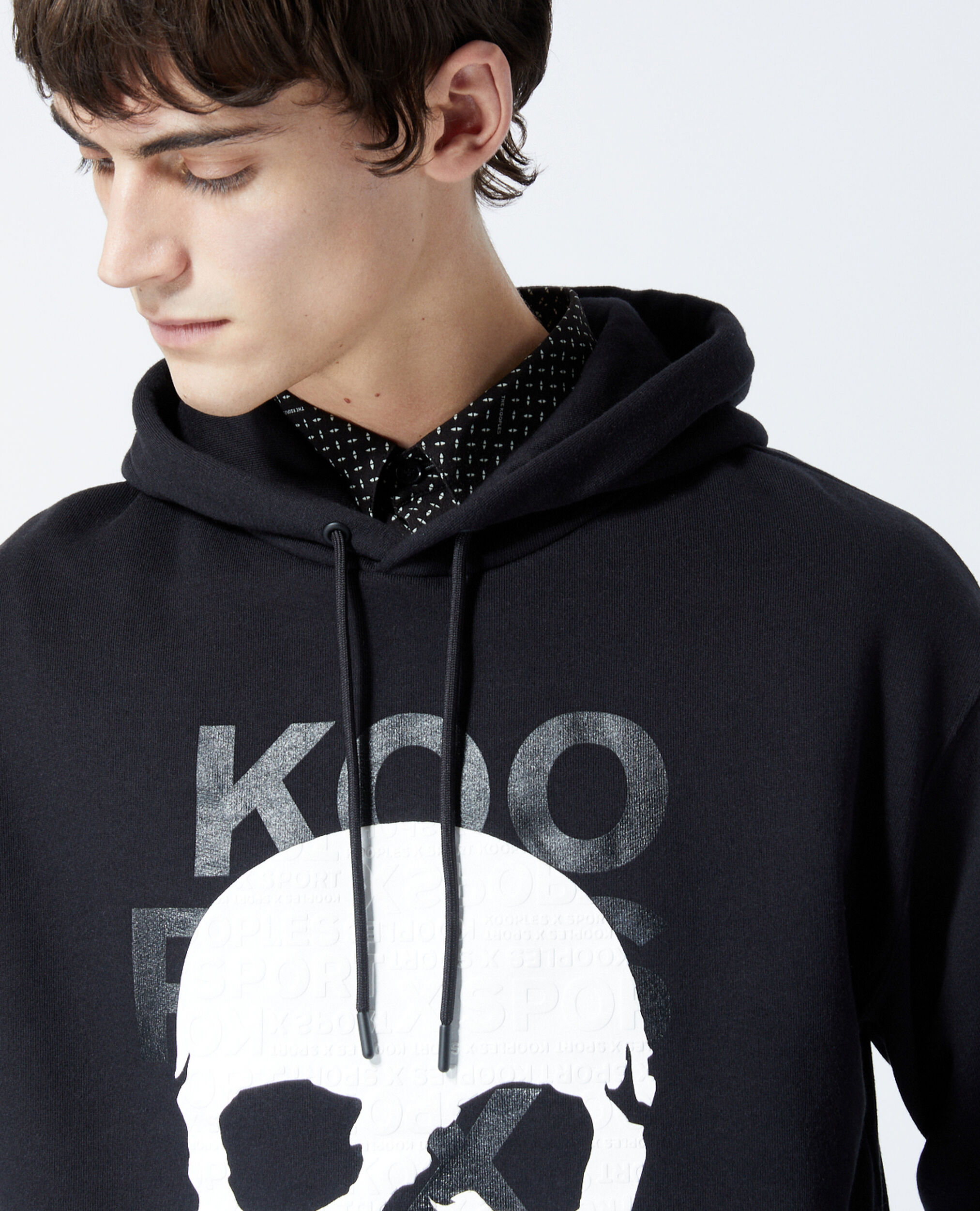 Black sweatshirt with hood and skull motif | The Kooples