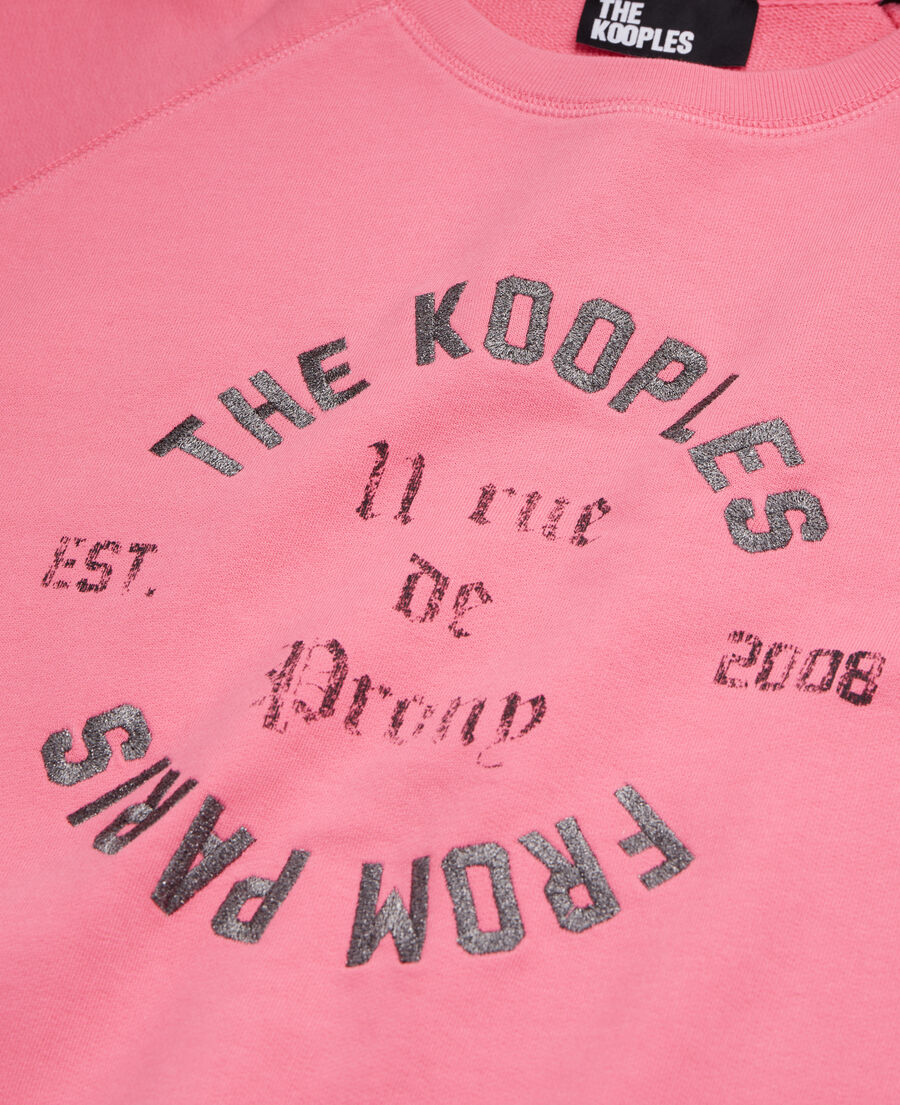 pink sweatshirt with 11 rue de prony serigraphy