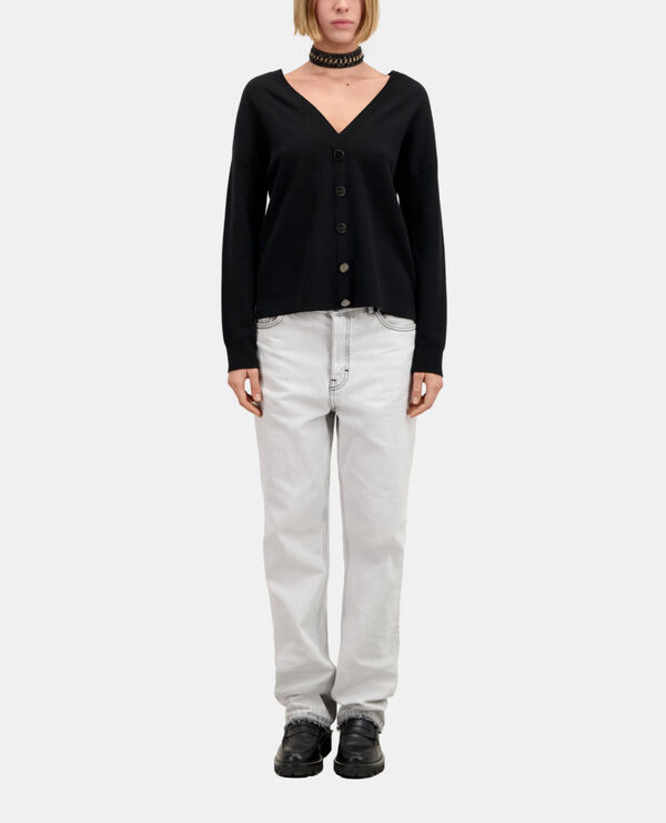 ecru sweater with buttoning on the back