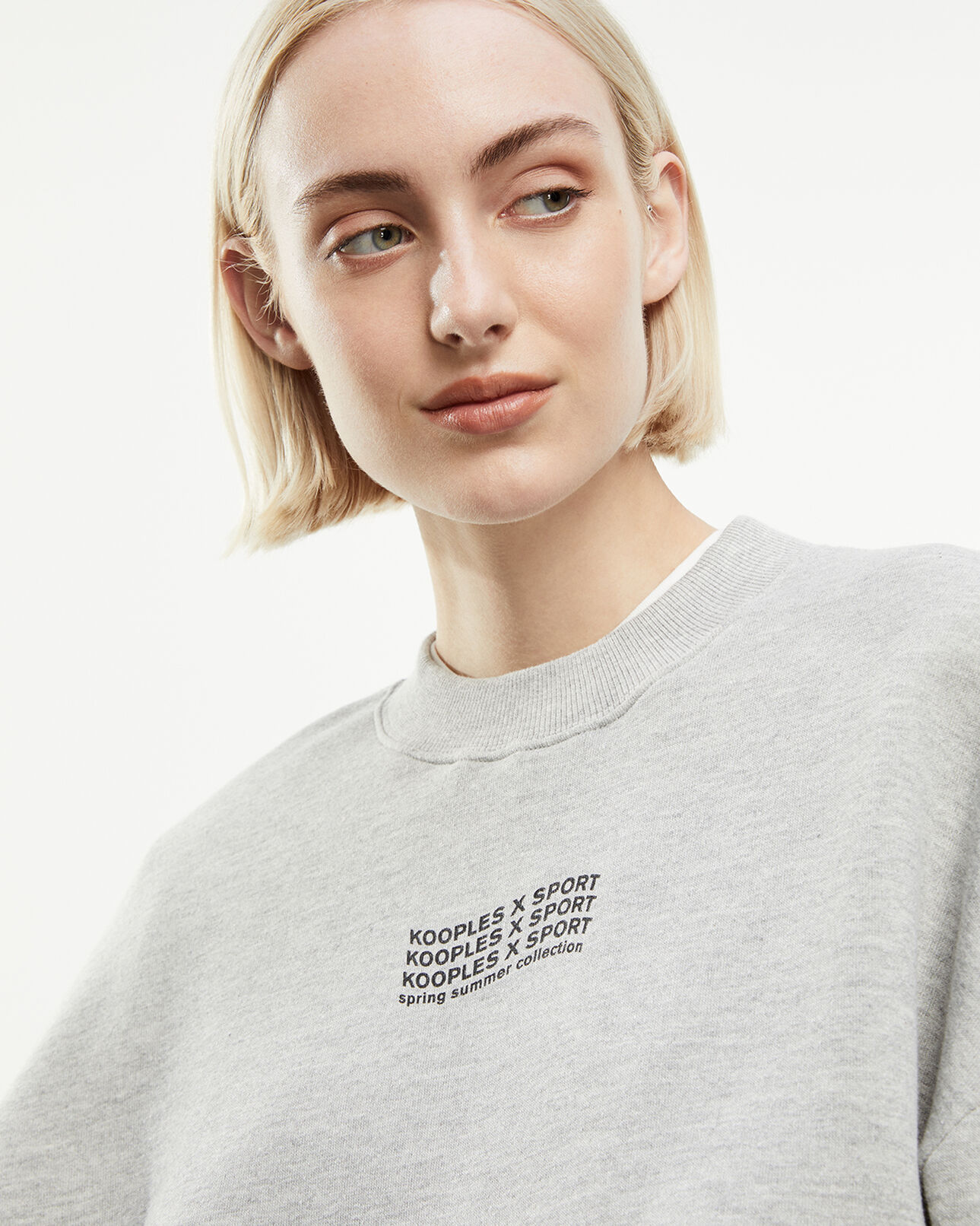 The Kooples FEMME LIGHT GREY MELANGE sweat gris à logo vague contrasté