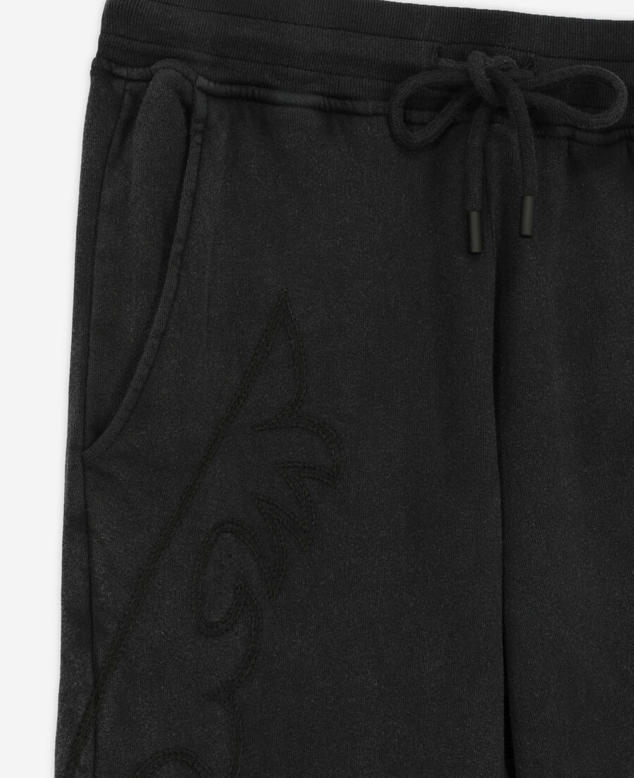 black joggers with western-style embroidery