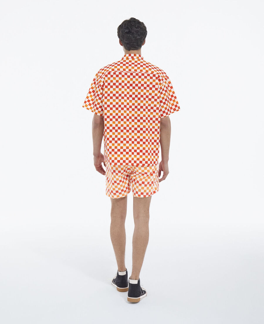 swim shorts with red and orange check motif