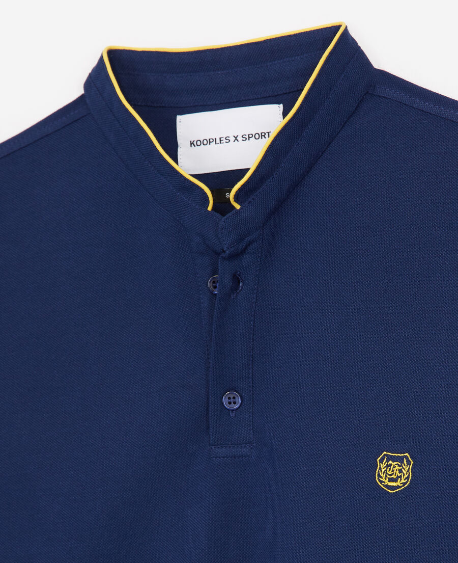 navy blue polo with light yellow details