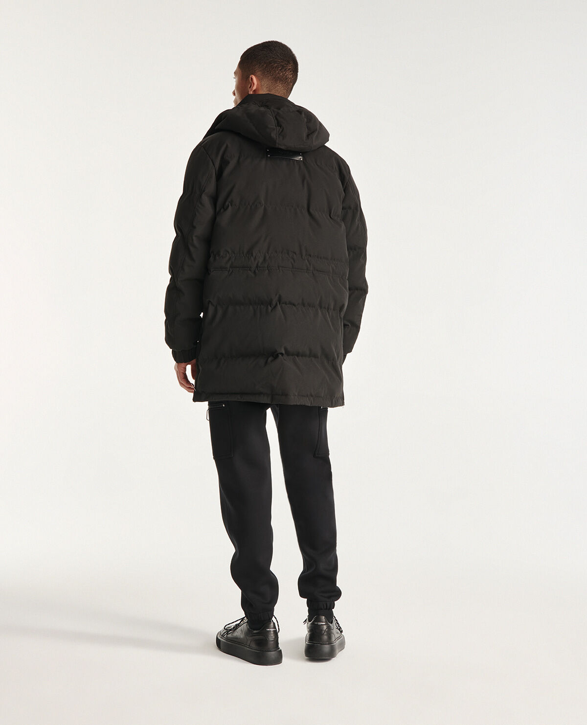 Long black nylon parka with removable hood