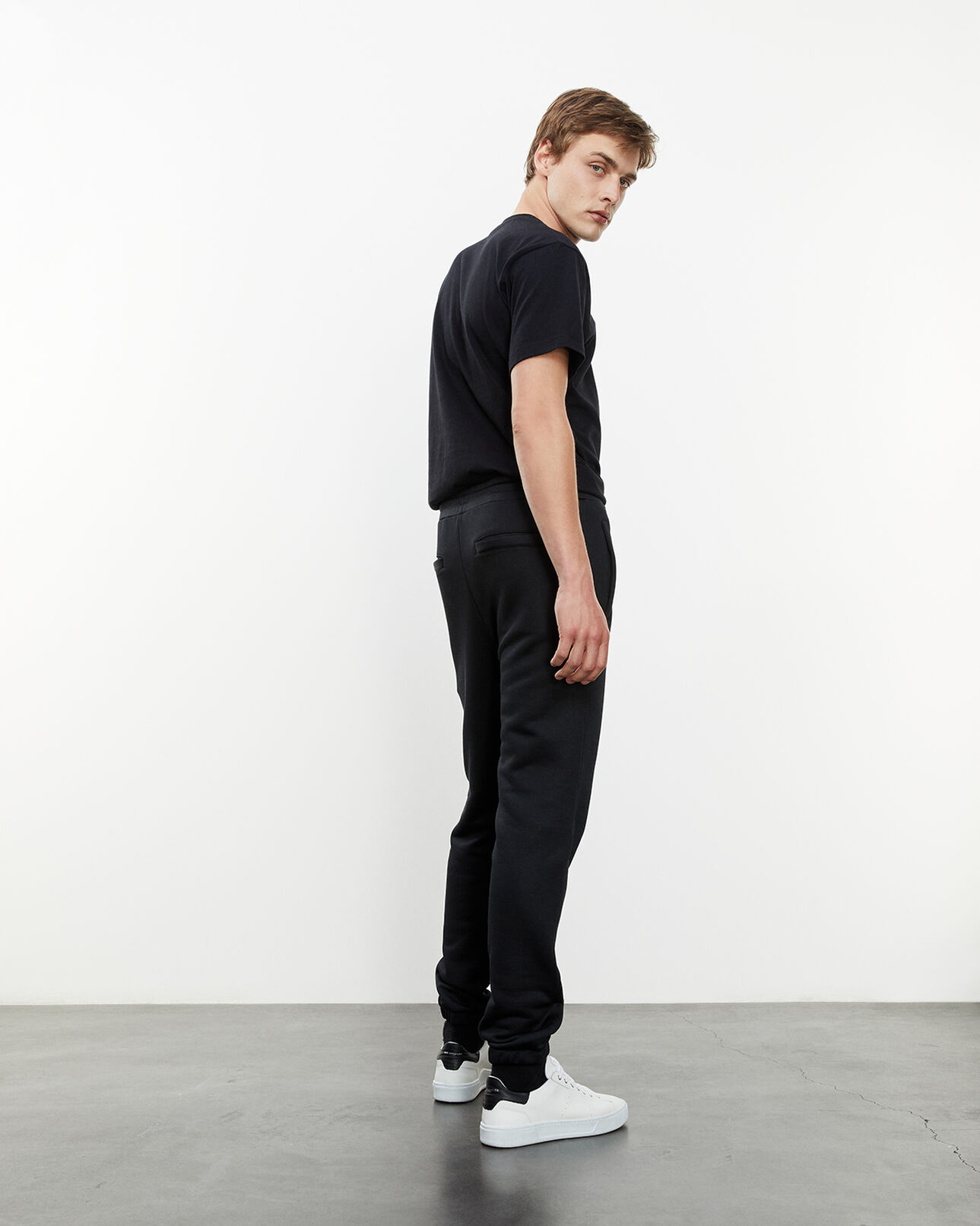 The Kooples HOMME BLACK jogging noir tissu technique à logo