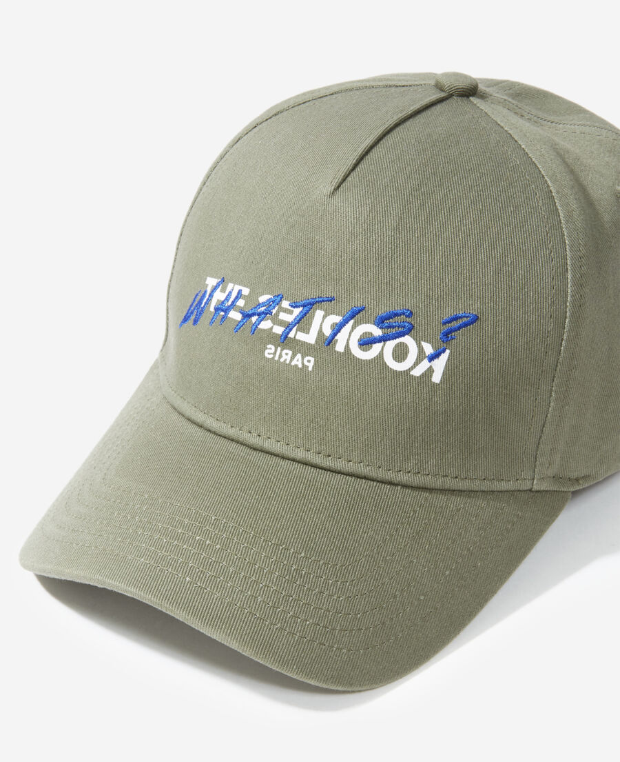 khaki cotton cap with embroidered “what is”