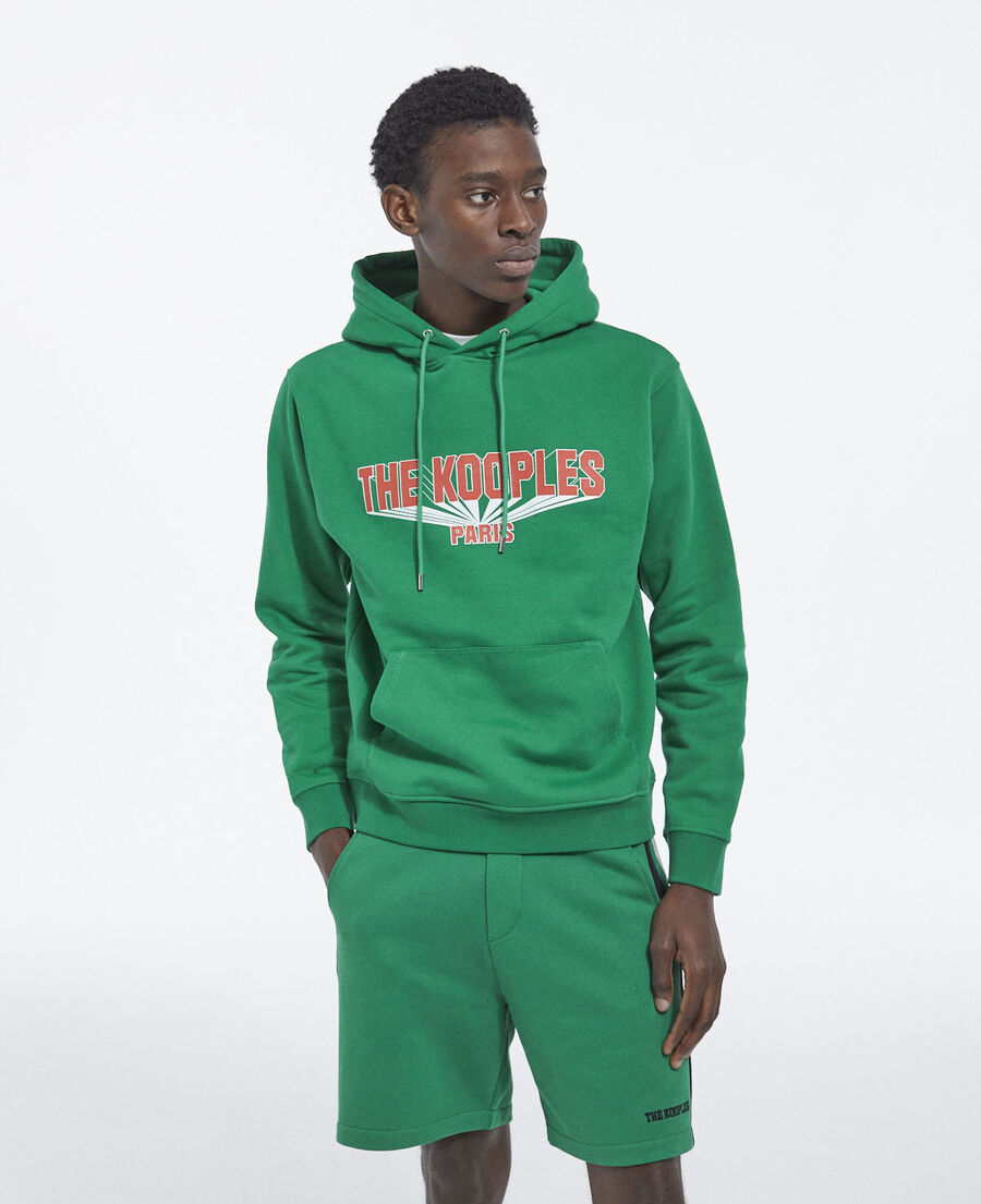 printed green hoodie with contrasting logo