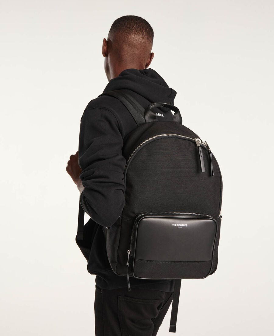 black backpack with imitation leather pocket