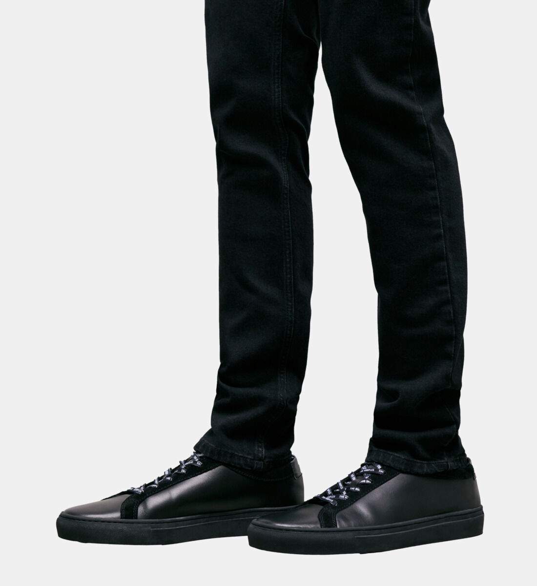 Solid black athletic shoes top