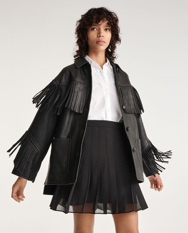 flowing short black skirt with pleating