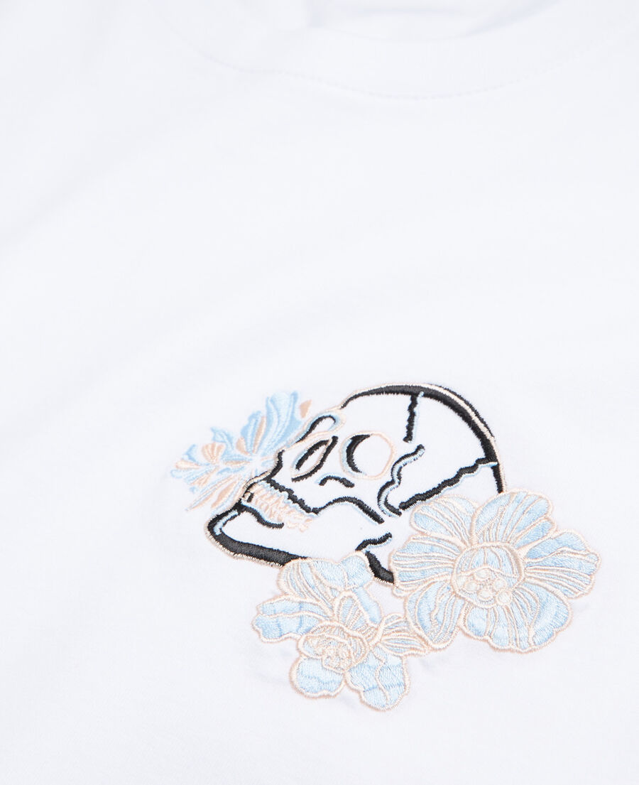 white printed t-shirt with skull and flowers
