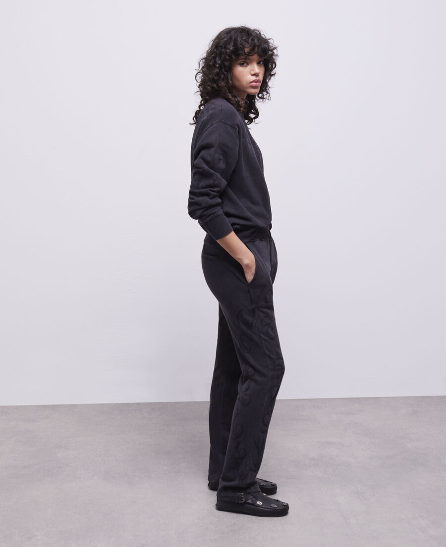 black joggers with western-style embroidery