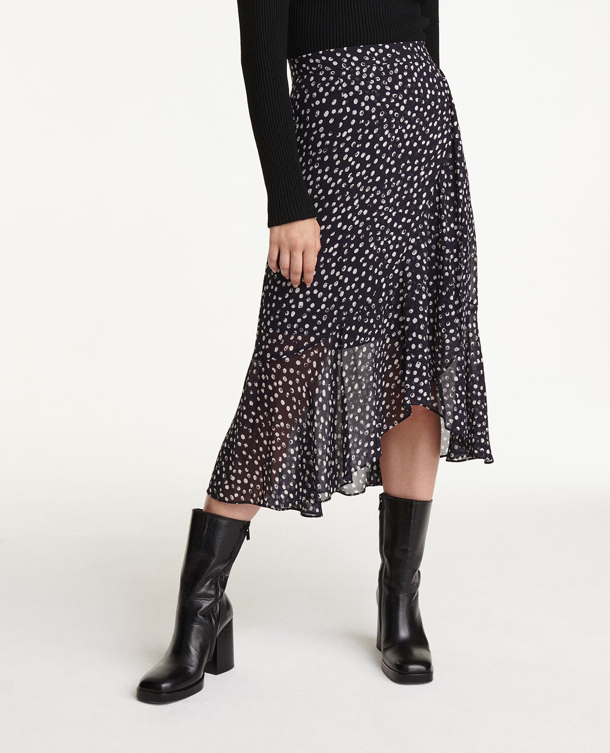 Long flowing navy blue skirt with polka dots