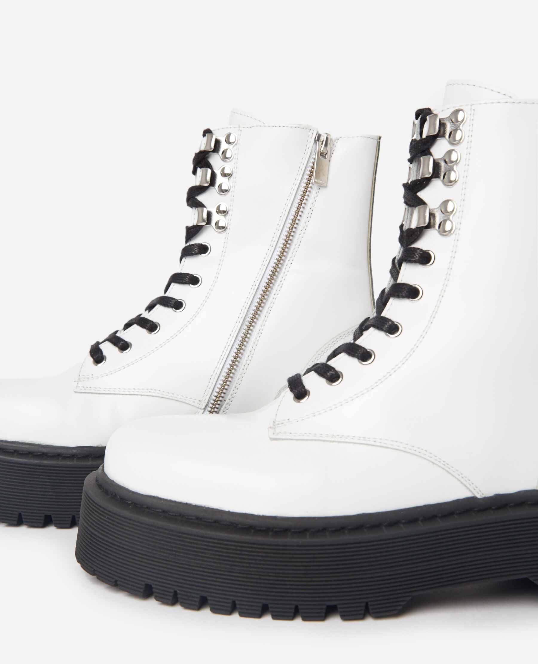 Flat lace up boots in glazed white leather
